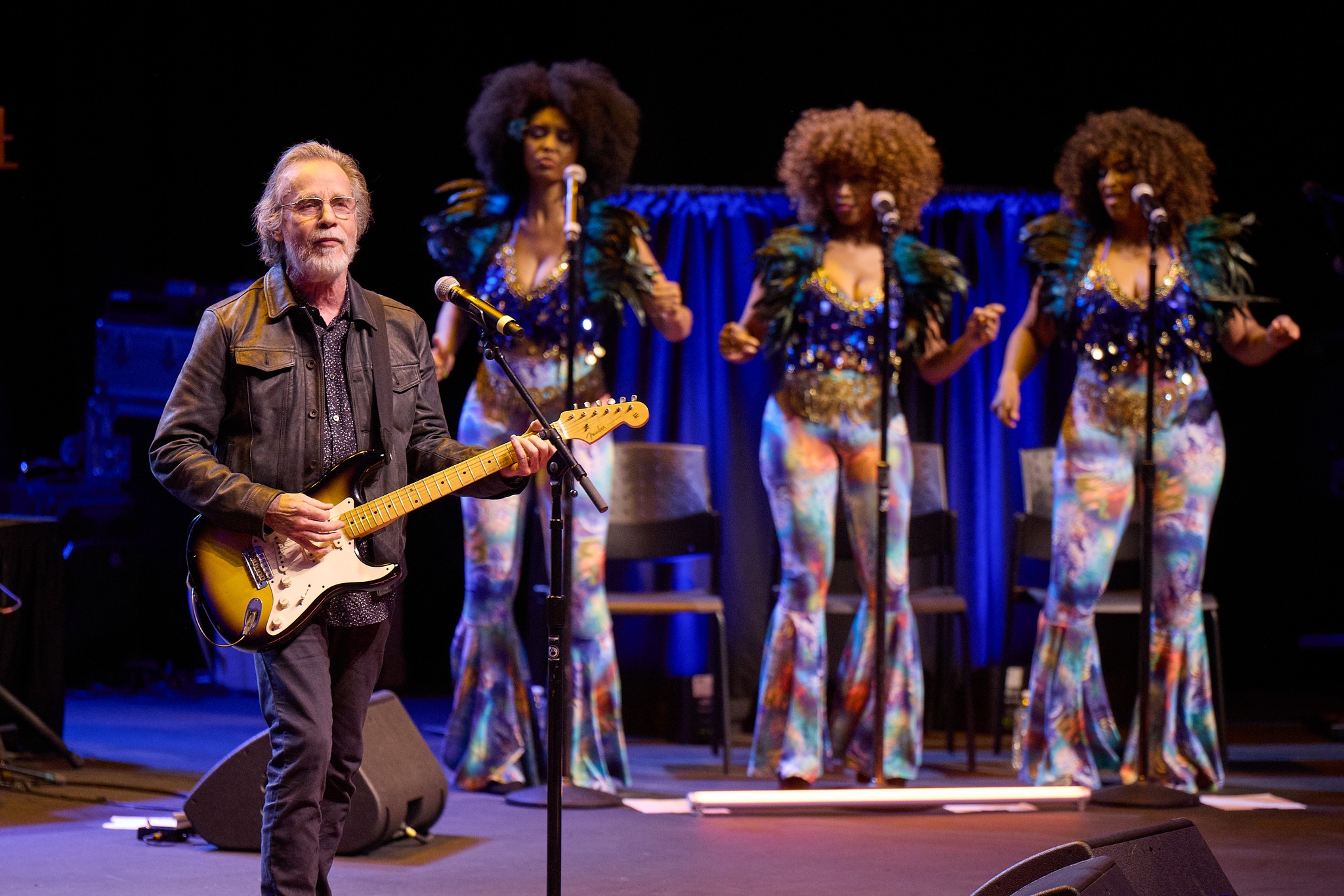 American Music Honors guitarist on stage with three backup singers
