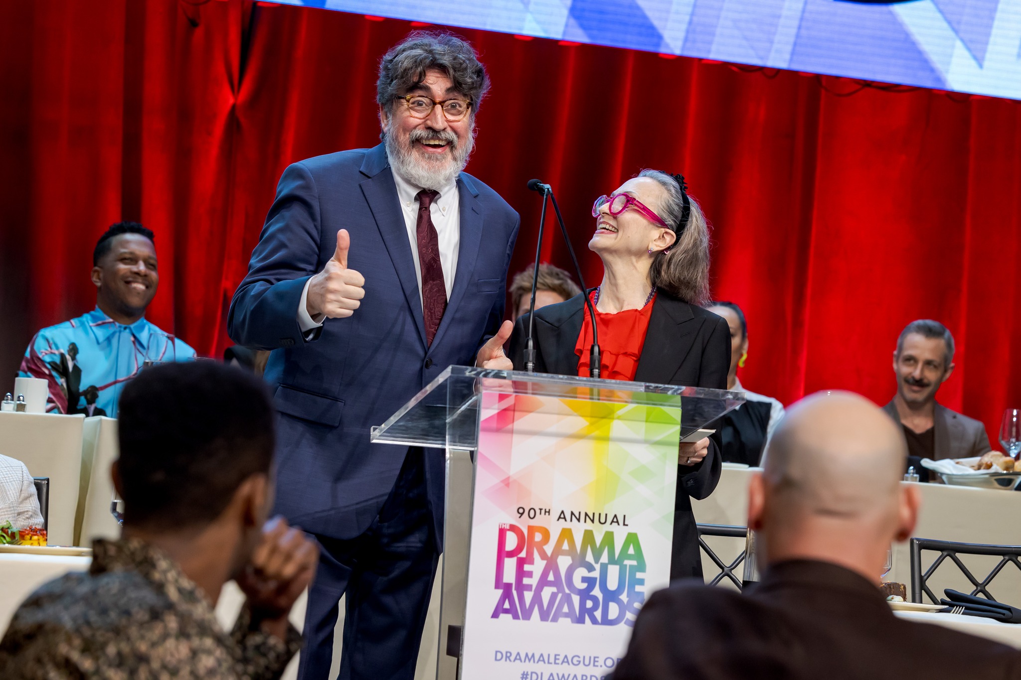 Two people at the podium for The 90th Annual Drama League Awards, 2024