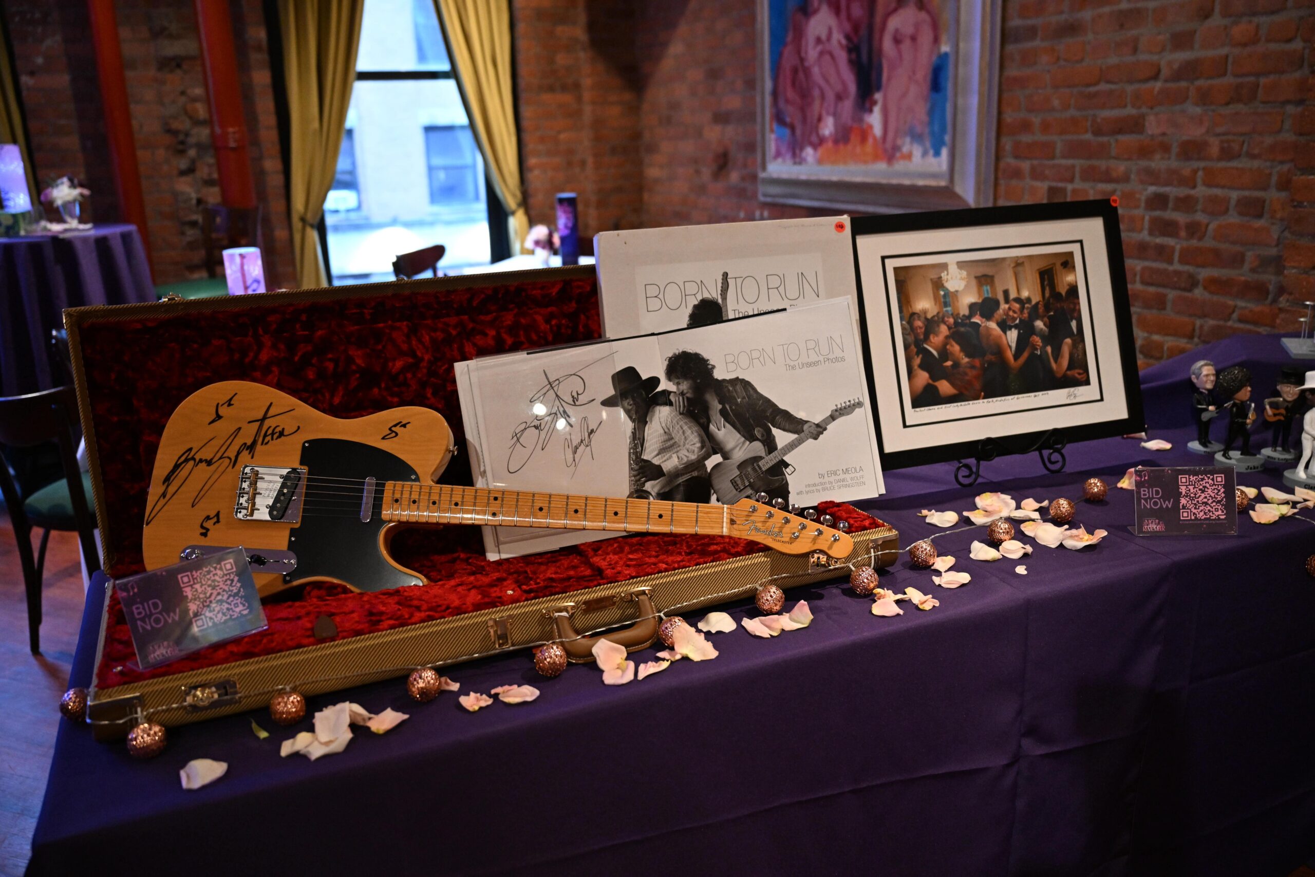 Bruce Springsteen born to run signed guitar on auction table