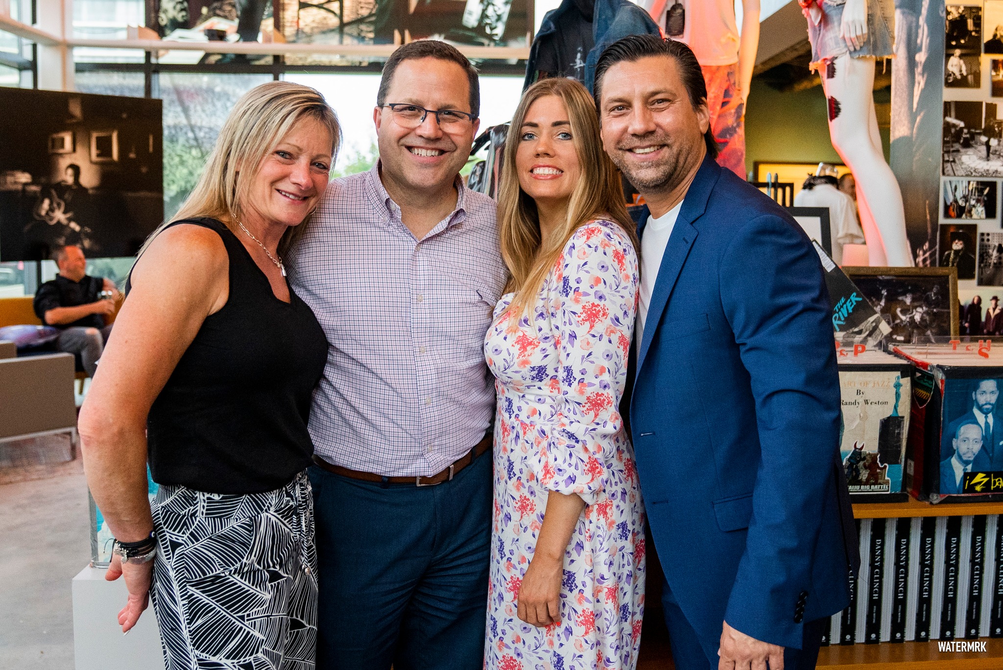 Group of four smiling for a photo